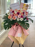 Pastel Bloom Prosperity Gerbera Opening Stand