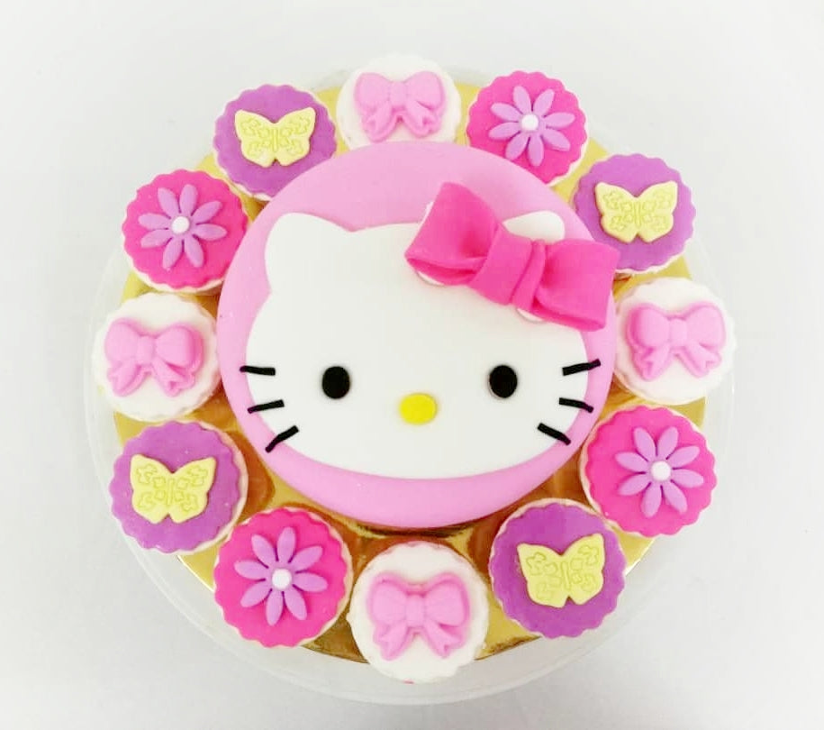 Kitty Cartoon Inspired Designer Cake and Cupcakes
